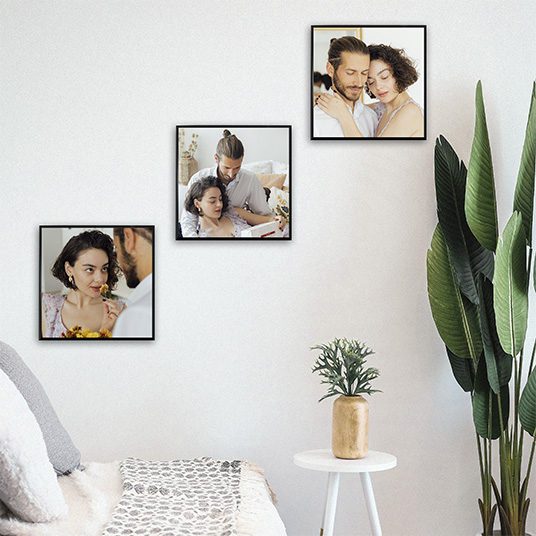 room with three photo tiles glued with black frame